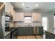 Kitchen featuring granite countertops, stainless steel appliances, subway tile backsplash and modern cabinetry at 2331 Bouldercliff Se Way, Atlanta, GA 30316