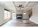 Light-filled living room featuring coffered ceiling, neutral walls, fireplace and hardwood floors at 2331 Bouldercliff Se Way, Atlanta, GA 30316