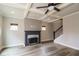 Bright living room featuring coffered ceiling, neutral walls, fireplace and hardwood floors at 2331 Bouldercliff Se Way, Atlanta, GA 30316