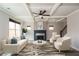 Staged living room featuring coffered ceiling, modern furnishings, fireplace and ample natural light at 2331 Bouldercliff Se Way, Atlanta, GA 30316
