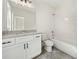 Modern bathroom with sleek vanity, granite counters, and a combined tub and shower at 3920 Bellair Dr, Marietta, GA 30066