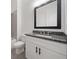 Modern bathroom featuring granite countertop, black hardware, and tub with gray tile surround at 3920 Bellair Dr, Marietta, GA 30066