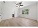 Spacious bedroom with hardwood floors, ceiling fan, and large windows providing natural light at 3920 Bellair Dr, Marietta, GA 30066