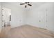Bright bedroom with hardwood floors and ceiling fan, with an ensuite bathroom and closet at 3920 Bellair Dr, Marietta, GA 30066