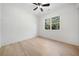 Bright bedroom with hardwood floors, white walls, and a large window overlooking the trees at 3920 Bellair Dr, Marietta, GA 30066
