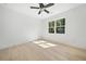 Well-lit bedroom showcasing beautiful hardwood floors and a large window at 3920 Bellair Dr, Marietta, GA 30066