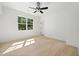 Bedroom featuring hardwood floors, ceiling fan, and natural light from a window at 3920 Bellair Dr, Marietta, GA 30066