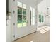 Entryway featuring light hardwood floors, white trim, and a view to the front yard at 3920 Bellair Dr, Marietta, GA 30066