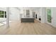 Elegant kitchen featuring white cabinetry, hardwood floors, and modern appliances at 3920 Bellair Dr, Marietta, GA 30066