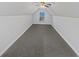 Finished attic with carpeted flooring, great for storage or as a playroom at 823 New Hope Rd, Mcdonough, GA 30252