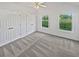 This bedroom has an overhead fan and 2 windows and 2 large closets at 823 New Hope Rd, Mcdonough, GA 30252