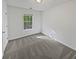 This is a cozy bedroom with a window letting in natural light, freshly painted and carpeted at 823 New Hope Rd, Mcdonough, GA 30252