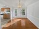 Dining room with beautiful wood floors, a chandelier and decorative molding at 823 New Hope Rd, Mcdonough, GA 30252