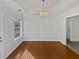 Dining room with beautiful wood floors, a chandelier and decorative molding at 823 New Hope Rd, Mcdonough, GA 30252
