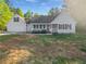 Charming one-story home featuring a covered front porch, attached garage, and well-maintained lawn at 823 New Hope Rd, Mcdonough, GA 30252
