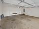 Spacious two-car garage for parking and storage, access to the back yard at 823 New Hope Rd, Mcdonough, GA 30252