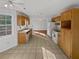 Traditional kitchen featuring white appliances, tile floors and eat in breakfast area at 823 New Hope Rd, Mcdonough, GA 30252
