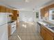 Traditional kitchen featuring white appliances, tile floors and eat in breakfast area at 823 New Hope Rd, Mcdonough, GA 30252