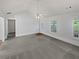 Spacious living room with vaulted ceilings, neutral paint, and lots of natural light at 823 New Hope Rd, Mcdonough, GA 30252