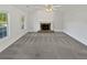 Bright living room featuring a fireplace, vaulted ceilings, and large windows at 823 New Hope Rd, Mcdonough, GA 30252