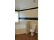 Bathroom featuring a tub with black and cream tile, offering a modern look at 9399 Whaleys Lake Ln, Jonesboro, GA 30238