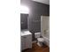 Bathroom featuring white sink vanity and a shower with a white shower surround at 9399 Whaleys Lake Ln, Jonesboro, GA 30238