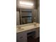 Bathroom featuring a dual sink vanity with ample counter space and storage at 9399 Whaleys Lake Ln, Jonesboro, GA 30238