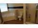 Bathroom featuring a tub and a separate shower stall with neutral color tones at 9399 Whaleys Lake Ln, Jonesboro, GA 30238