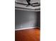 Bedroom with hardwood flooring, modern fan, neutral paint and clean trim at 9399 Whaleys Lake Ln, Jonesboro, GA 30238