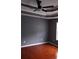 Bedroom with hardwood flooring, modern fan, neutral paint and clean trim at 9399 Whaleys Lake Ln, Jonesboro, GA 30238