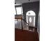Inviting home foyer with wood floors and a staircase leading to the upper level at 9399 Whaleys Lake Ln, Jonesboro, GA 30238