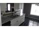 Kitchen with stainless steel sink, mosaic backsplash, and tile flooring with stainless steel appliances at 9399 Whaleys Lake Ln, Jonesboro, GA 30238