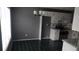 Open-concept kitchen with black tile flooring, stainless steel appliances, and a large window at 9399 Whaleys Lake Ln, Jonesboro, GA 30238
