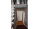 Stairway leading to the next level, featuring hardwood steps and neutral walls at 9399 Whaleys Lake Ln, Jonesboro, GA 30238