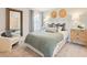 Cozy bedroom with a comfy chair, accent pillows, and wood décor at 1002 Sutherland Lane (Lot 36), Lawrenceville, GA 30043