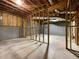 Unfinished basement with concrete flooring and block walls is ready for customization and personalization at 131 Diamond Ct, Carrollton, GA 30116