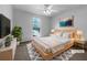 Bright bedroom with modern decor, a ceiling fan, and natural light at 131 Diamond Ct, Carrollton, GA 30116