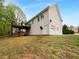 Exterior elevation features a wooden deck, vinyl siding, and an attached two-car garage, showcasing the backyard at 131 Diamond Ct, Carrollton, GA 30116