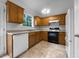 Functional kitchen equipped with wooden cabinets, and essential appliances at 131 Diamond Ct, Carrollton, GA 30116