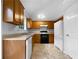 Functional kitchen equipped with wooden cabinets, and essential appliances at 131 Diamond Ct, Carrollton, GA 30116