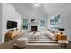 Bright living room with a fireplace, and large windows at 131 Diamond Ct, Carrollton, GA 30116