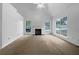 Living room featuring large windows and a fireplace at 131 Diamond Ct, Carrollton, GA 30116