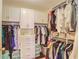 Spacious closet with custom shelving, drawers and ample hanging space at 211 Colonial Homes Nw Dr # 2106, Atlanta, GA 30309