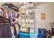 Organized closet with shelves, hanging racks, storage baskets and golf equipment at 211 Colonial Homes Nw Dr # 2106, Atlanta, GA 30309