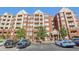 Apartment building with brick facade, multiple balconies, and on-site parking at 211 Colonial Homes Nw Dr # 2106, Atlanta, GA 30309