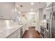 Updated kitchen with white cabinets, subway tile backsplash, and stainless steel appliances at 211 Colonial Homes Nw Dr # 2106, Atlanta, GA 30309