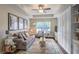 Bright living room with trey ceiling, large windows, modern ceiling fan and hardwood floors at 211 Colonial Homes Nw Dr # 2106, Atlanta, GA 30309