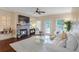 Cozy living room features a stone fireplace with mounted TV and lots of natural light at 211 Colonial Homes Nw Dr # 2106, Atlanta, GA 30309
