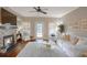 Inviting living room with stone fireplace, large windows, and comfortable seating area at 211 Colonial Homes Nw Dr # 2106, Atlanta, GA 30309