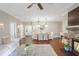 Spacious living and dining area with fireplace, hardwood floors, and modern décor at 211 Colonial Homes Nw Dr # 2106, Atlanta, GA 30309